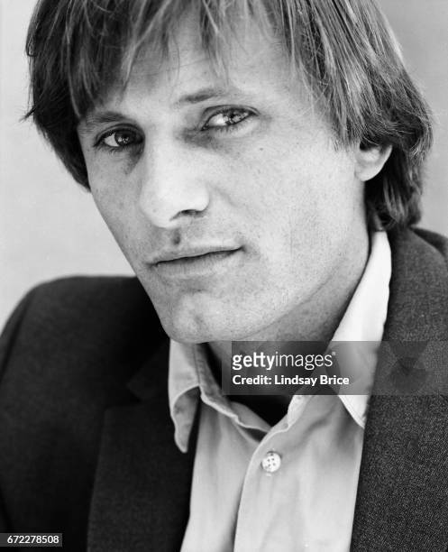 Close-up view of Viggo Mortensen dressed in a button-down shirt and sport coat, he looks directly into the lens during a photo session on April 13,...
