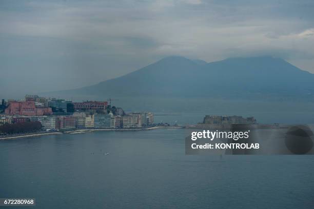 View of Naples covered with smog. Because of a particular climatic condition the city is covered by a cloud of smog. For days there is no wind and...