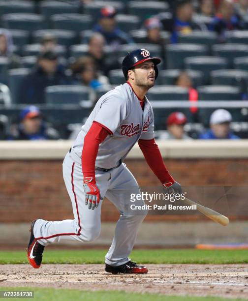 Chris Heisey of the Washington Nationals hits a single in an MLB baseball game against the New York Mets on April 21, 2017 at CitiField in the Queens...