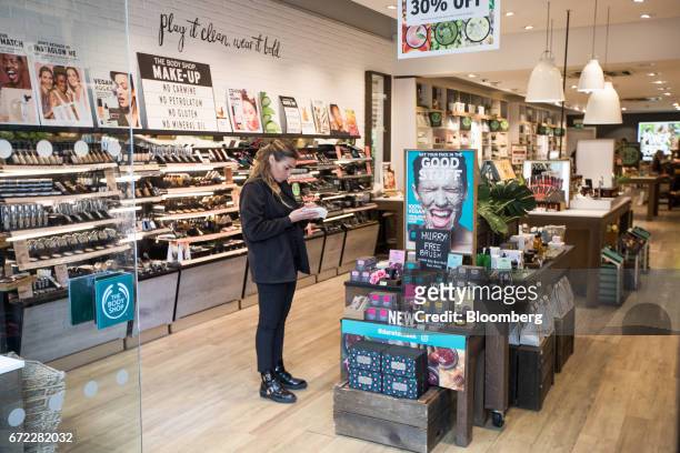 Shop assistant works inside a branch of The Body Shop, operated by L'Oreal SA, in central London, U.K., on Monday, April 24, 2017. U.K. Consumer...