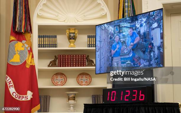 In this NASA handout, NASA astronauts Peggy Whitson and Jack Fischer are seen onboard the International Space Station in a live video conference...