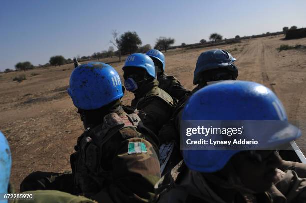 Villagers from Shawa village of the Zaghawa tribe live in a makeshift camp a few hundred meters from the UNAMID base in Labado, outside of...