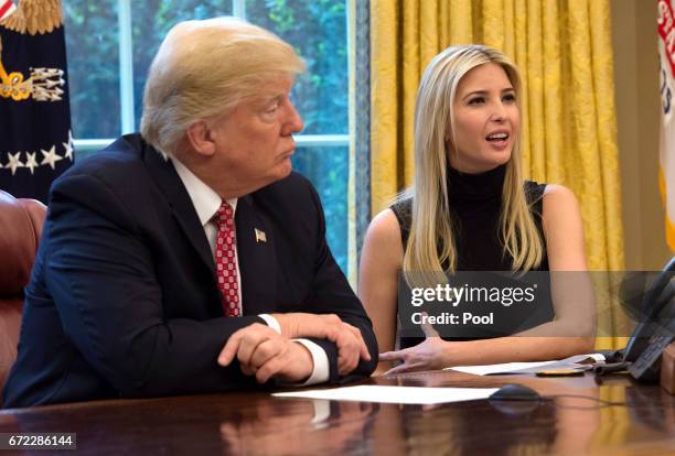 President Donald Trump listens while his daughter Ivanka speaks during a video conference with NASA astronauts aboard the International Space Station...