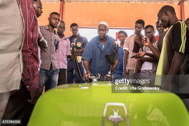 Matourkou, Burkina Faso Young agricultural students and apprentices are told how to deal with a farm machine. Innovation center in the CAP-Matourkou...