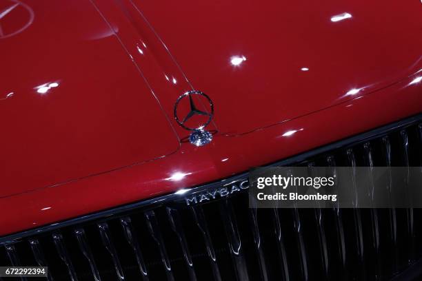 Badge sits on the hood of an ultra luxury Vision Mercedes-Maybach 6 all-electric automobile, manufactured by Mercedes-Benz AG, at the Istanbul...