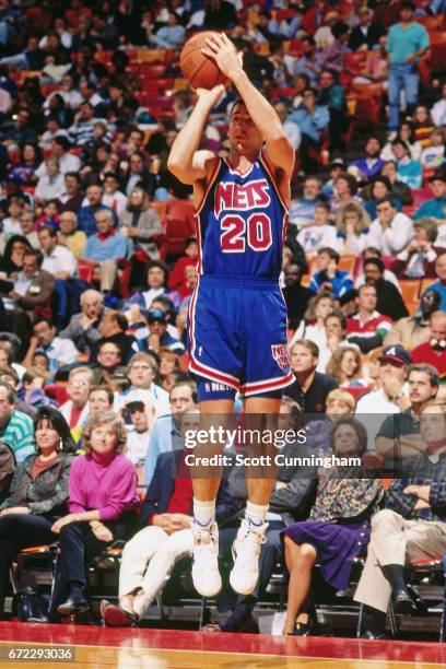 Doug Lee of the New Jersey Nets shoots against the Atlanta Hawks during a game played circa 1990 at the Omni in Atlanta, Georgia. NOTE TO USER: User...