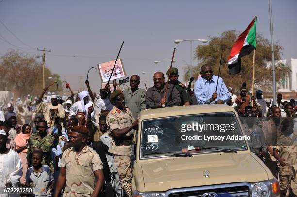 Sudanese President Omar Al Bashir parades through the streets of El Fasher in North Darfur before holding a rally in El Fasher, Sudan, March 8, 2009....