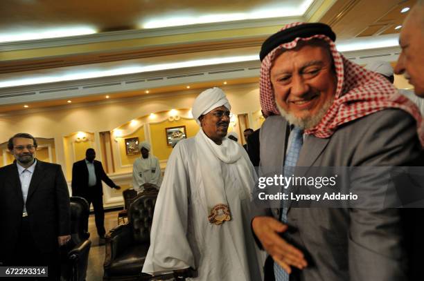 Sudanese President Al Bashir greets Iranian Speaker of parliment, Ali Larijani, along with a high level delegation of Arab and Iranians, including...