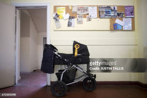 Pushchair adorned with a Liberal Democratic Party rosette is pictured at a campaign event in London on April 24 in the build-up to the general...
