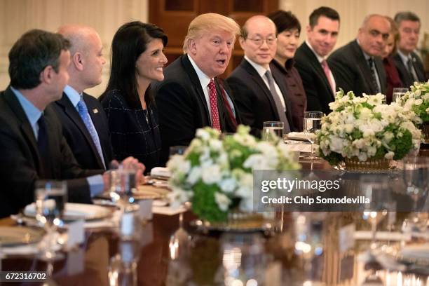 President Donald Trump delivers remarks while hosting ambassadors from the 15 country members of the United Nations Security Council with his...