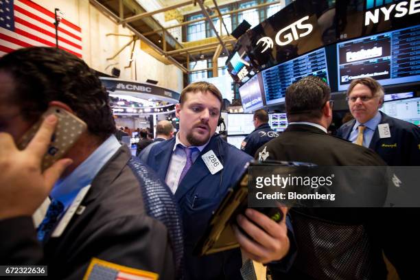 Trader works on the floor of the New York Stock Exchange in New York, U.S., on Monday, April 24, 2017. U.S. Stocks climbed as the weekend vote in...