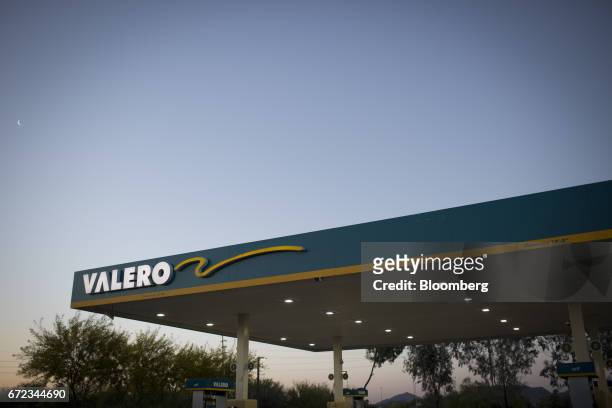 Signage is displayed at a Valero Energy Corp. Gas station in Phoenix, Arizona, U.S., on Saturday, April 22, 2017. Valero is scheduled to release...