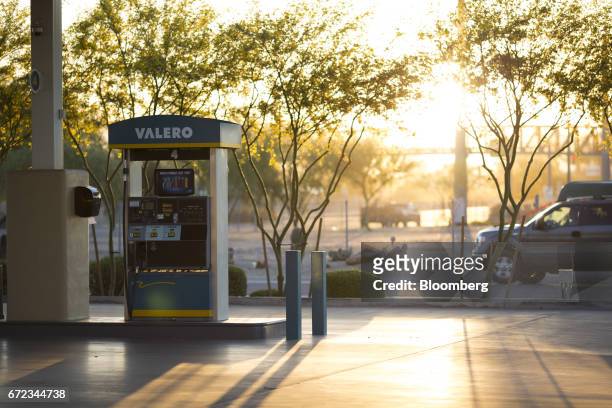 Gas pump stands at a Valero Energy Corp. Gas station in Phoenix, Arizona, U.S., on Saturday, April 22, 2017. Valero is scheduled to release earnings...