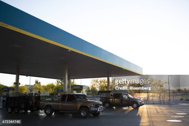 Vehicles refuel at a Valero Energy Corp. Gas station in Phoenix, Arizona, U.S., on Saturday, April 22, 2017. Valero is scheduled to release earnings...