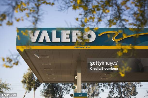 Signage is displayed at a Valero Energy Corp. Gas station in Phoenix, Arizona, U.S., on Saturday, April 22, 2017. Valero is scheduled to release...