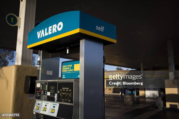 Signage is displayed on a fuel pump at a Valero Energy Corp. Gas station in Phoenix, Arizona, U.S., on Saturday, April 22, 2017. Valero is scheduled...
