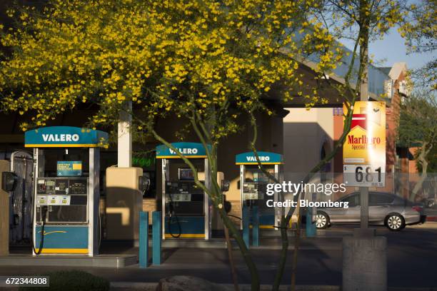 Gas pumps stand at a Valero Energy Corp. Gas station in Phoenix, Arizona, U.S., on Saturday, April 22, 2017. Valero is scheduled to release earnings...