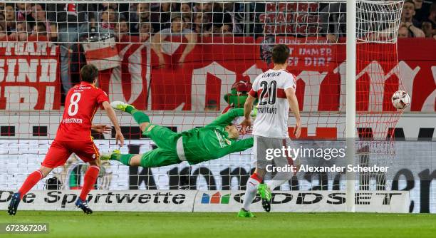 Alexandru Maxim of Stuttgart scores the first goal for his team against Daniel Mesenhoeler of Berlin during the Second Bundesliga match between VfB...