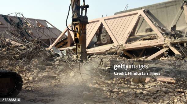 Workers demolish the Hall of Industries at Pragati Maidan, designed by architect Raj Rewal and engineer Mahendra Raj, at Pragati Maidan on April 24,...