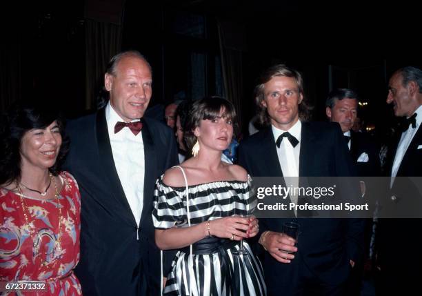 Bjorn Borg of Sweden with his fiance Marianna Simionescu and coach Lennart Bergelin at the Wimbledon Champions Ball after Borg won the men's singles...