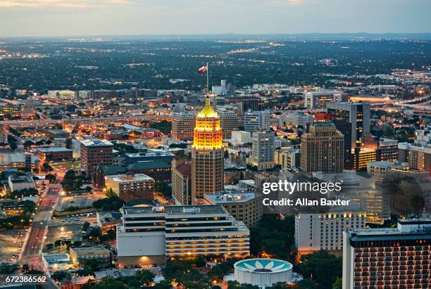 aerial view of san antonio illuminated at dusk - san antonio stock pictures, royalty-free photos & images