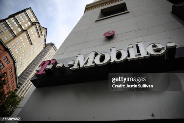 The T-Mobile logo is displayed outside of a T-Mobile store on April 24, 2017 in San Francisco, California. T-Mobile will report first quarter...