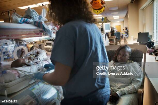 Lavatrice Jordan holds one of her twins, LaGlorian Jordan, who was born on April 1 at 26 weeks and just over one pound, in the Neo-natal Intensive...
