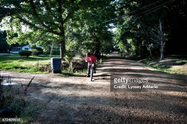 Christopher Jackson rides his bike to meet with his neighborhood friends in Holmes County, at the edge of the Mississippi Delta, May 31, 2012....