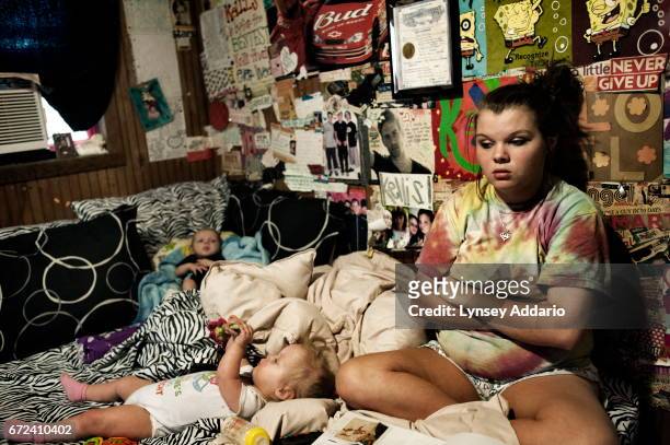 Maranda Corely sits in her bedroom with her three childrenin their bedroom in Ellisville, Mississippi, June 2, 2012. Maranda got pregnant for the...