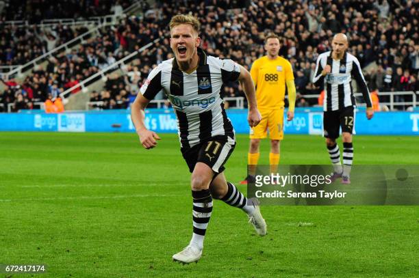 Matt Ritchie of Newcastle United celebrates after he scores Newcastle's third goal from the penalty spot during the Sky Bet Championship match...