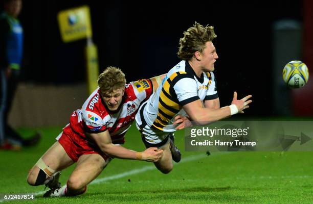 Tom Howe of Wasps A is tackled by Ollie Thorley of Gloucester United during the Aviva A League Semi Final match between Gloucester United and Wasps...