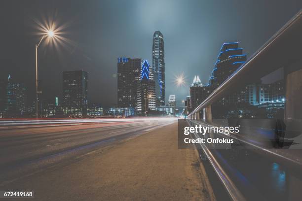 city of austin texas congress avenue at night - austin nightlife stock pictures, royalty-free photos & images