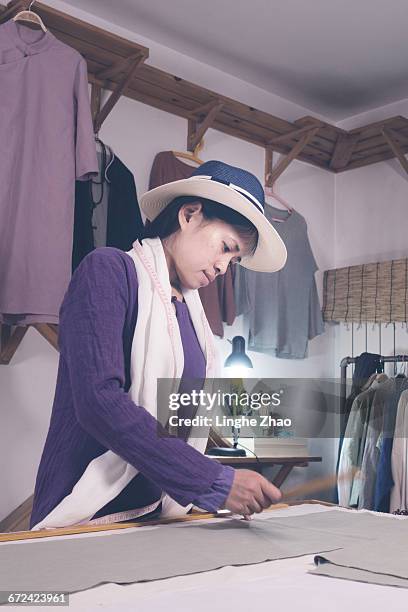 working on a new clothes - linghe zhao stock pictures, royalty-free photos & images