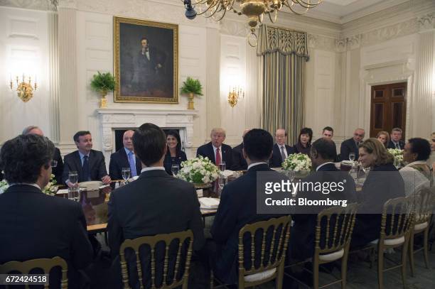 President Donald Trump, center, and Nikki Haley, U.S. Ambassador to the United Nations , center left, host a working lunch with members of the UN...