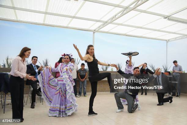 Laura Franco, President of Laureles Foundation and Klara Bierhoff dance with mexican folkloric dancers during the visit and unveiling of plaque for...