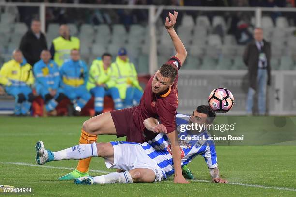 Roma player Edin Dzeko and Pescara calcio player Cesare Bovo compete for the ball during the Serie A match between Pescara Calcio and AS Roma at...