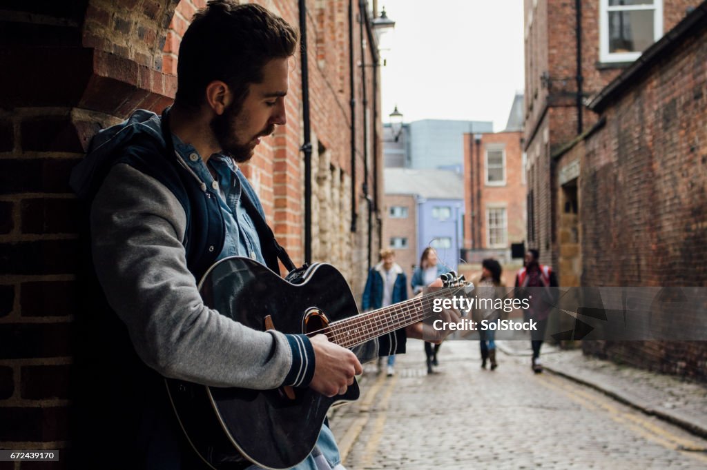 Busker In The Street High-Res Stock Photo - Getty Images