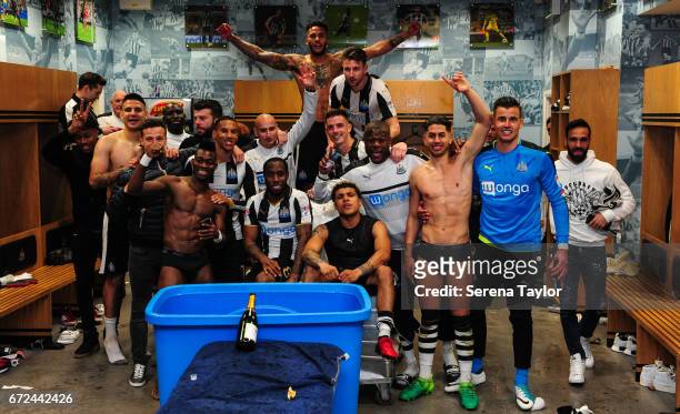 Newcastle players celebrate in the dressing room after sealing promotion to the premier league during the Sky Bet Championship match between...