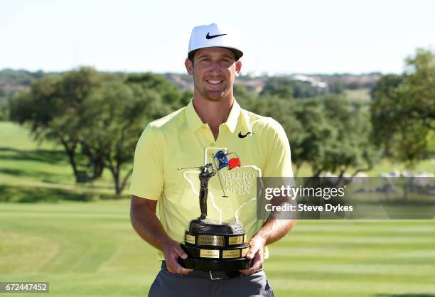 Kevin Chappell celebrates with the trophy during the final round of the Valero Texas Open at TPC San Antonio AT&T Oaks Course on April 23, 2017 in...