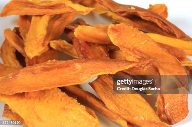 dried fruit mango chips (mangifera indica) - mango salsa stock pictures, royalty-free photos & images