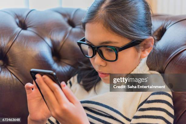 japanese girl using smart phone - デジタルディスプレイ stock pictures, royalty-free photos & images