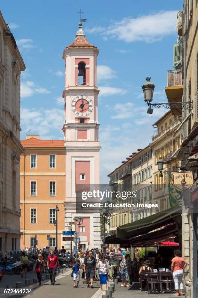 Nice, Cote d'Azur, French Riviera, France, Vieille Ville, the Old Town, View down Rue de la Prefecture to the clock tower beside the Tribunal...