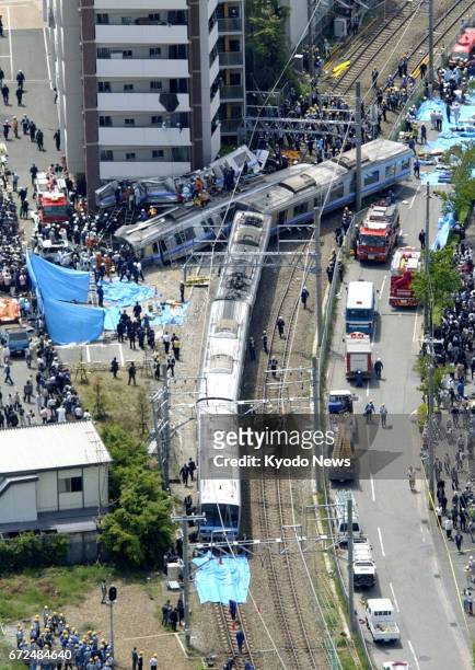 File photo taken in April 2005 shows a rush-hour commuter train derailing in Amagasaki, Hyogo Prefecture, western Japan. On April 25 the country...