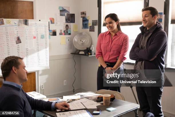 The Audit" Episode 413 -- Pictured: Kyle Bornheimer as Teddy Wells, Melissa Fumero as Amy Santiago, Andy Samberg as Jake Peralta --