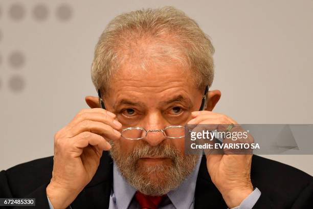 Former Brazilian President Luiz Inacio Lula da Silva gestures while delivering a speech at a seminar on "Strategies for the Brazilian Economy"...
