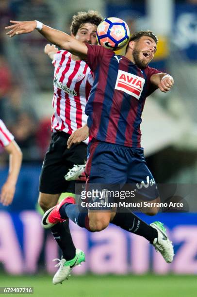 Sergi Enrich of SD Eibar duels for the ball with Yerran Alvarez of Athletic Club during the La Liga match between SD Eibar and Athletic Club at...