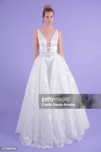 Model poses on seamless paper at the Isabelle Armstrong Spring 2018 bridal presentation during New York Fashion Week: Bridal April 2017 at The London...