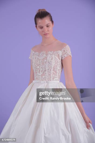 Model poses on seamless paper at the Isabelle Armstrong Spring 2018 bridal presentation during New York Fashion Week: Bridal April 2017 at The London...