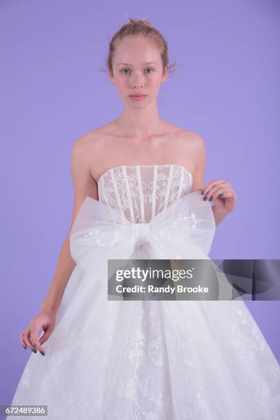 Model poses on seamless paper at the Isabelle Armstrong Spring 2018 bridal presentation during New York Fashion Week: Bridal April 2017 at The London...