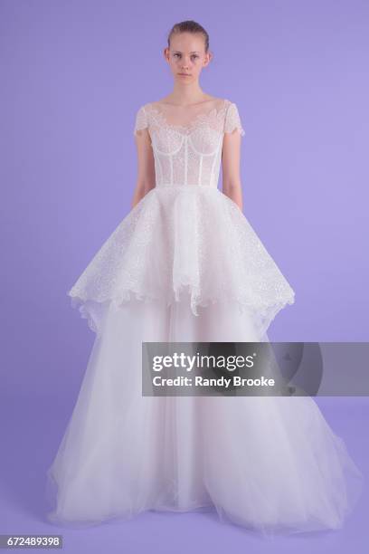 Model poses on seamless paper at the Isabelle Armstrong Spring 2018 bridal presentation during New York Fashion Week: Bridal April 2017 at The London...